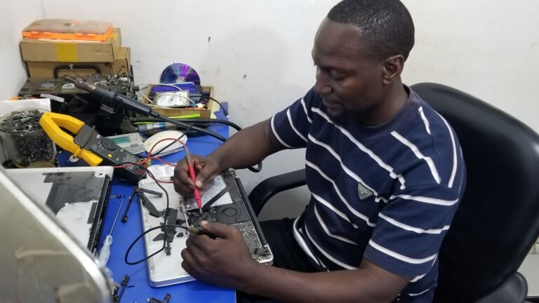 Mac technician Kampala repairing a MacBook at Microstar Andy Majestic Plaza